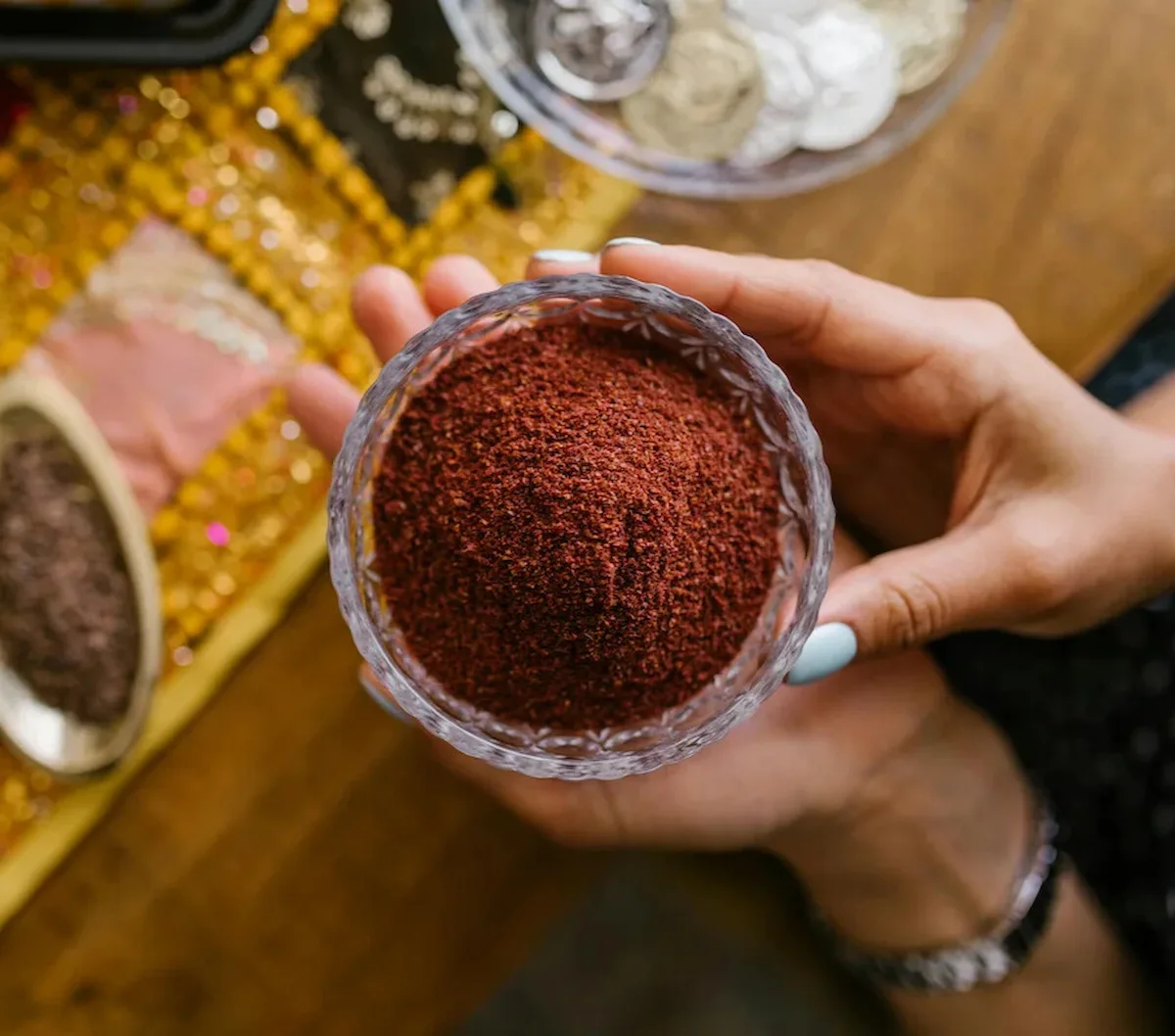 | Every Ingredient a woman holding a cup of Zesty Sumac Spice